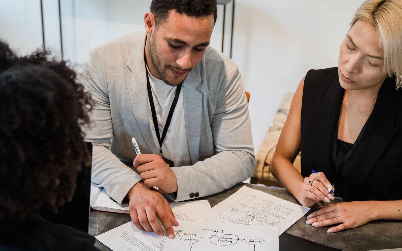 Colleagues reviewing documents together at a desk